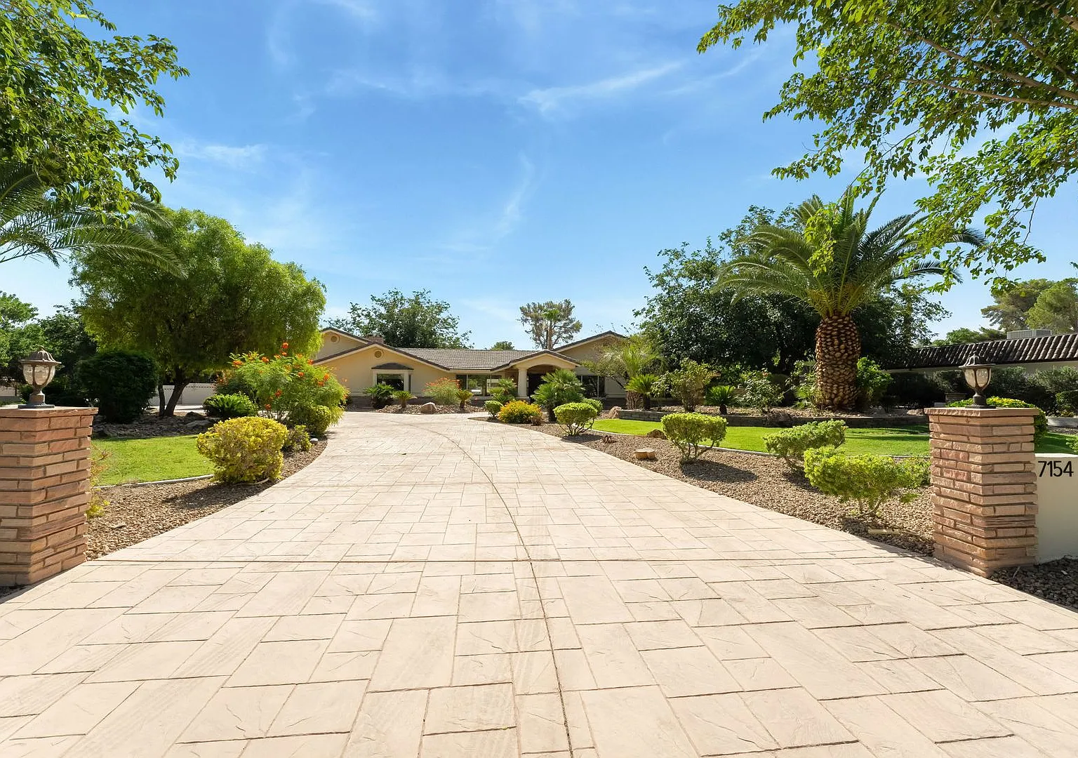 A stunning custom estate nestled in the prestigious Sierra Vista Ranchos — Photo 1