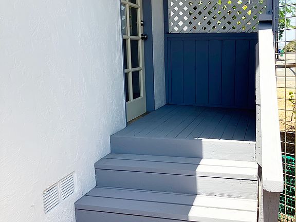 North side entrance connecting living room to backyard