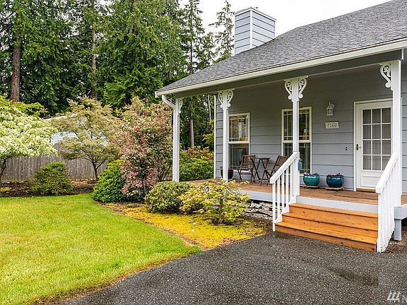Appealing entry welcomes you home.  There is a fence on the North property line and a hedge that lines the South line for a bit of green as you come in.