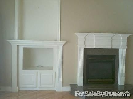 Fireplace/Built-in TV Cabinet
						:
						Living Room with marable hearth/ built-in TV storage/ display shelves above.