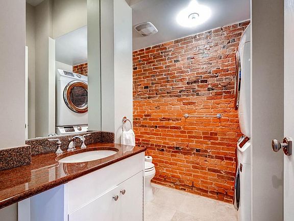 Half bath with new full sized washer dryer