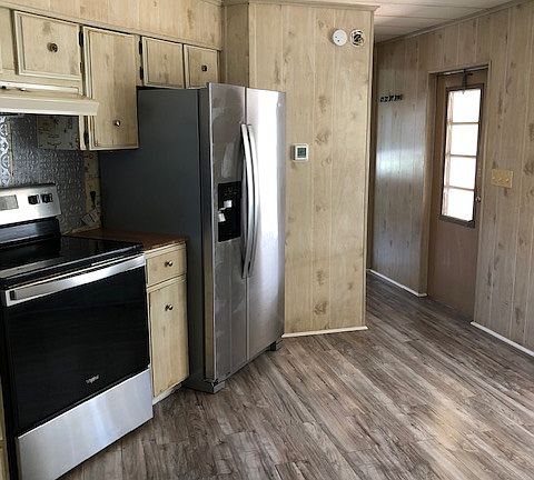Kitchen with Stainless Steel Appliances - Engineered hardwood throughout the home
