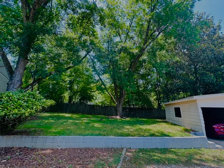 Backyard and detached 2 car garage.