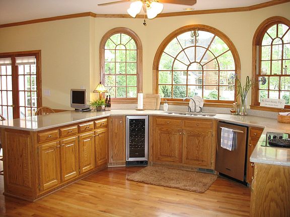 Huge kitchen with silestone, SS appliances, wine cooler and gorgeous windows