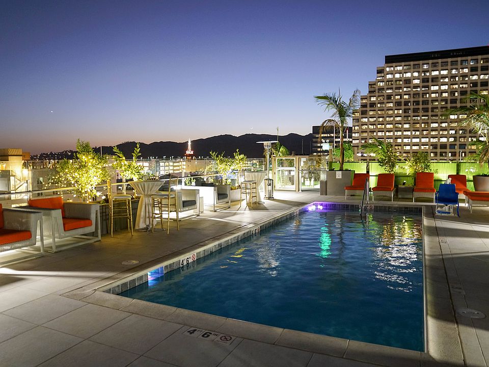 Maia Avira Rooftop Pool at Dusk