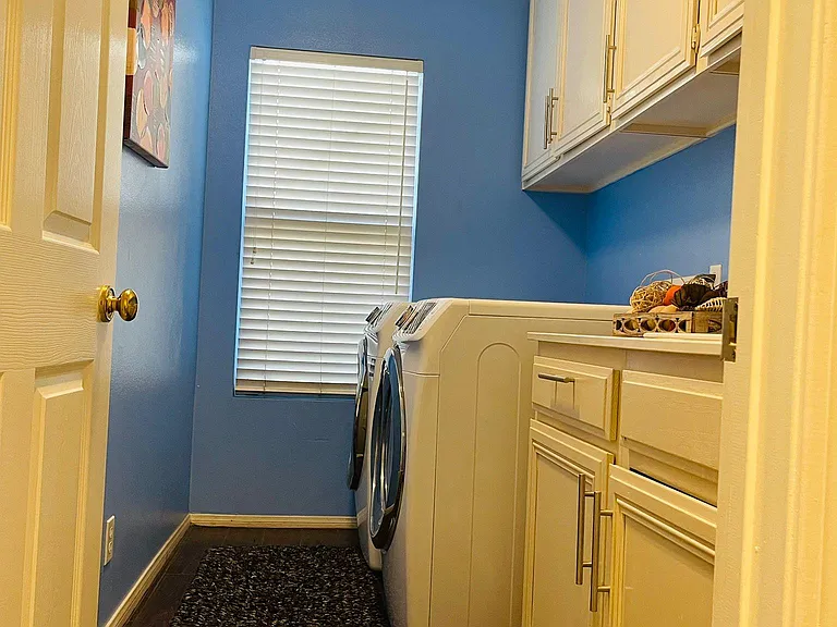 Laundry Room with plenty of closets