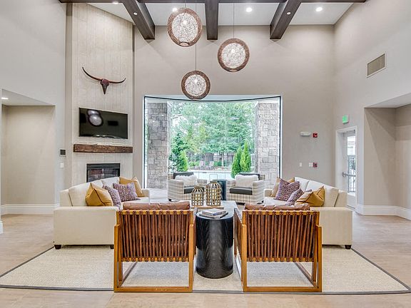 Newly renovated clubhouse with lounge furniture and fireplace