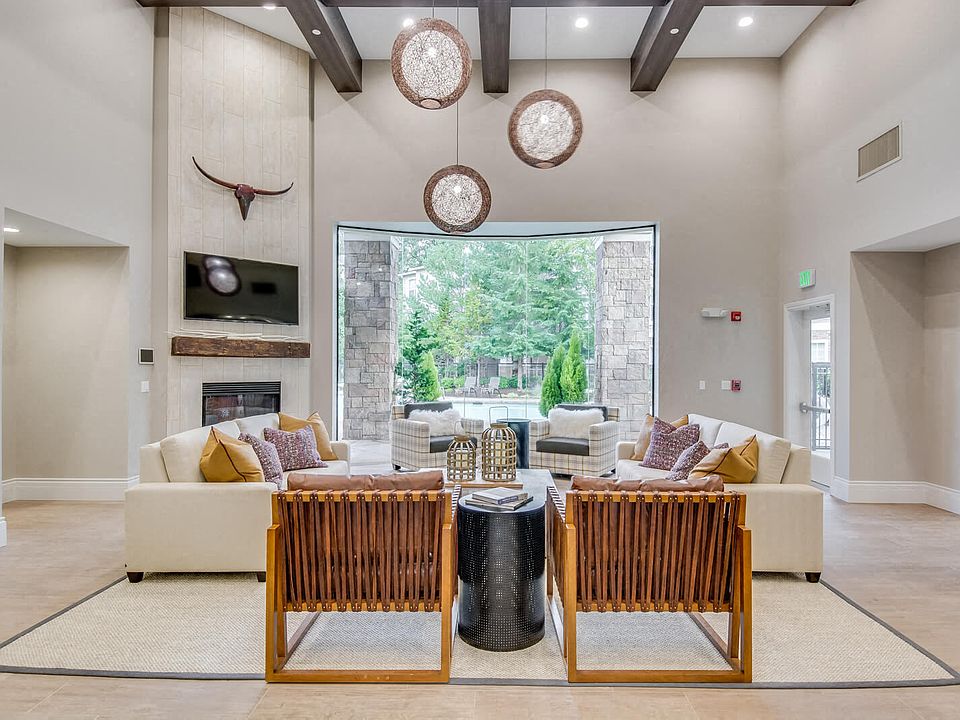 Newly renovated clubhouse with lounge furniture and fireplace