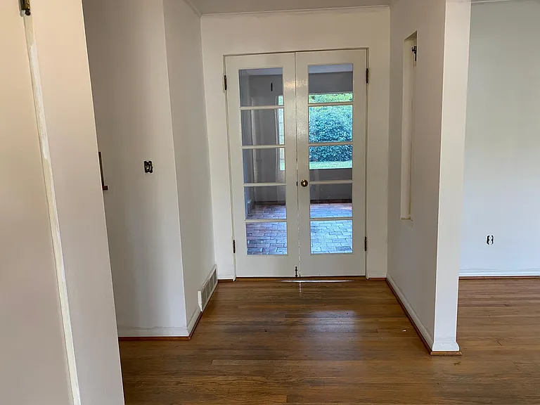 Entry with beautiful French doors.