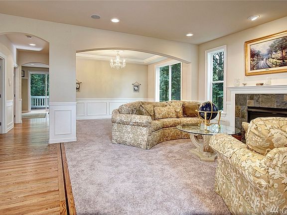 Graceful archway divides the formal living room and formal dining rooms providing each space with distinction while allow you to extend into each space as entertainment needs pop up!