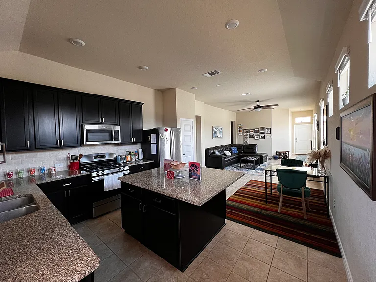 Kitchen, dining area, living room complete view