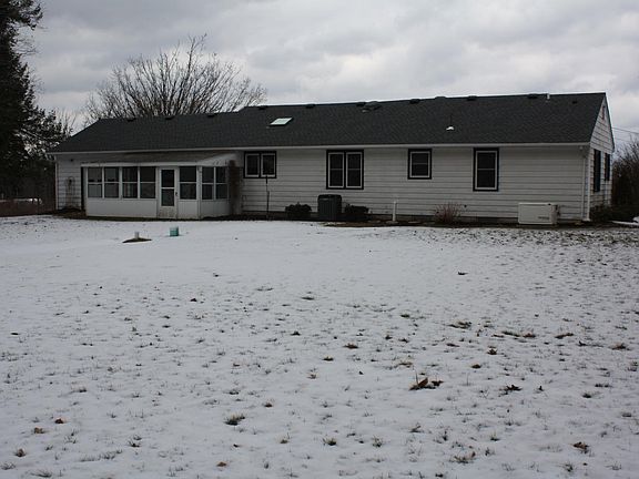 rear house elevation, note screened sunroom