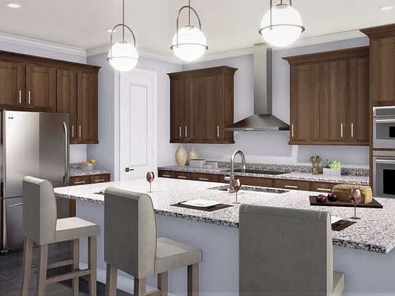 This kitchen is a culinary enthusiast s dream, offering an expansive center island with granite coun