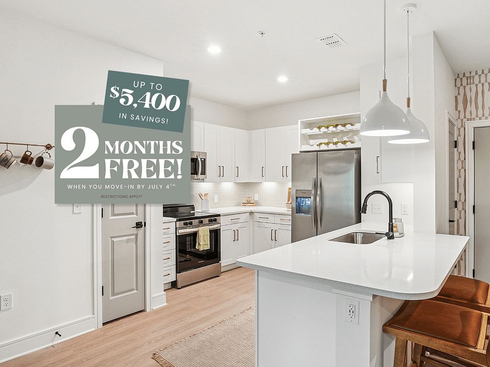 Kitchen with Quartz Countertop and Stainless Steel Appliances.