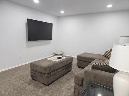 Family room with large TV and plenty of room .