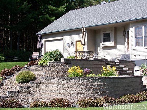Beautiful landscaping surrounds this home.