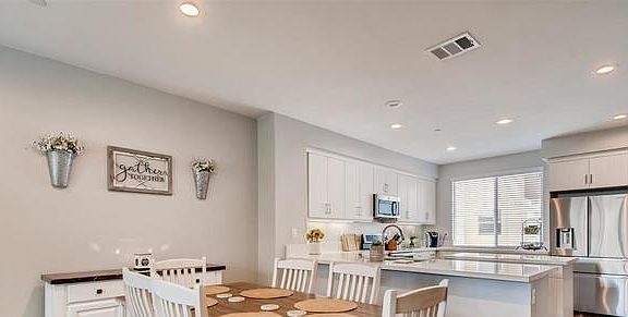 Dining area is next to the kitchen & living room
