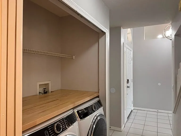 Laundry closet with premium washer and dryer!