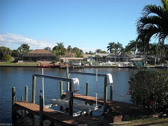 Wrap around boat dock with lift and there is also a concrete cantilever dock...
