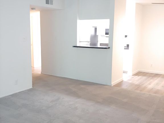 View of the area leading to the hall. Taken from the living room.