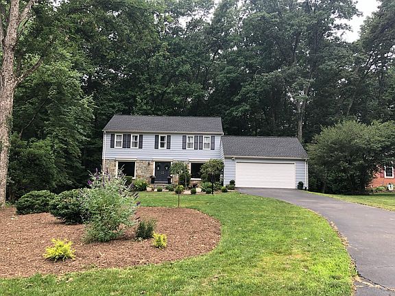 Extended front lawn with a beautiful garden