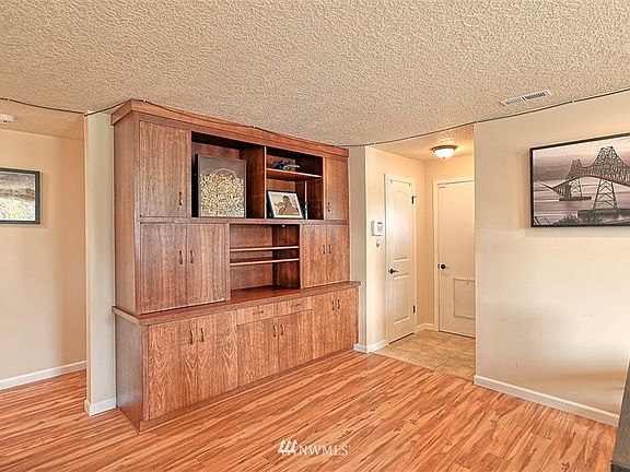 Gorgeous built-in bookcase has lots of compartments for storage!