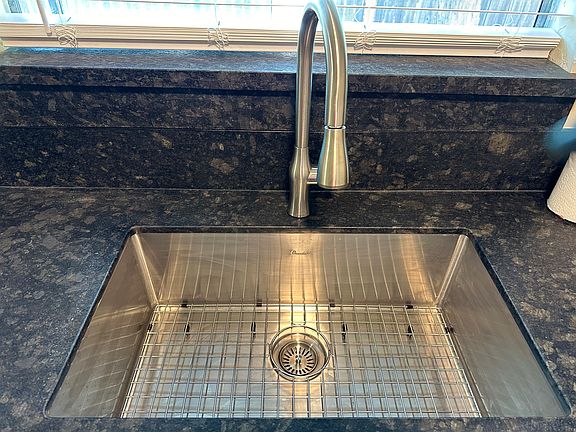 New stainless steel sink and faucet