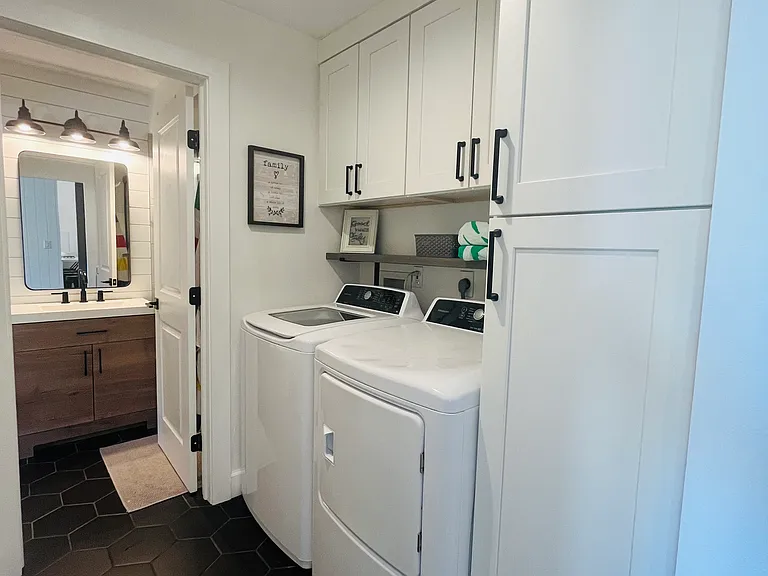 Laundry room and additional pantry storage.