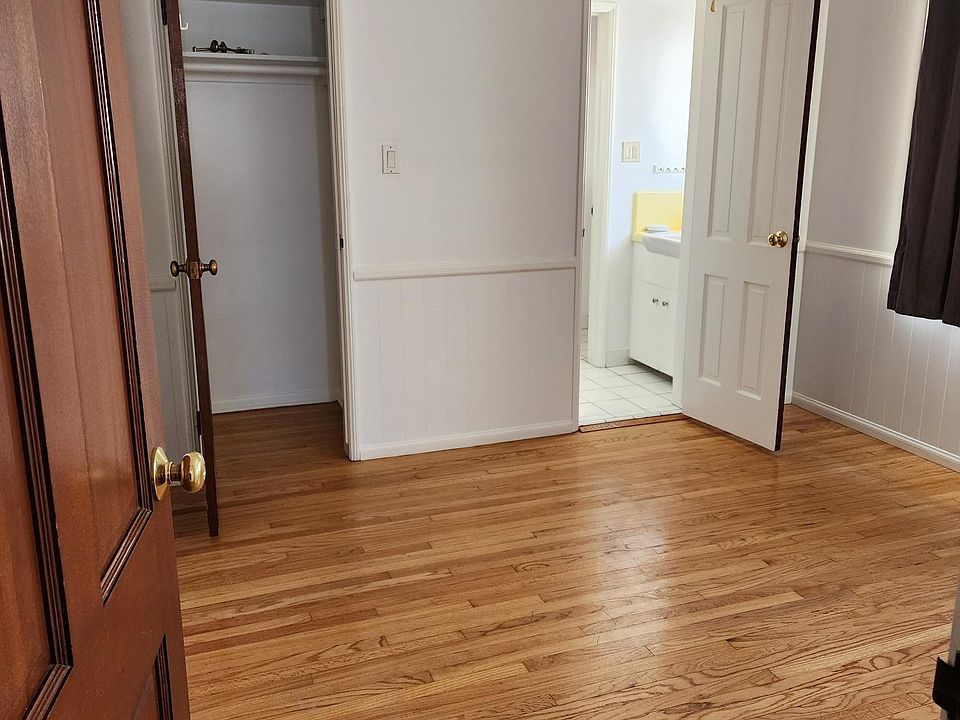 Bedroom adjacent to half bath.
