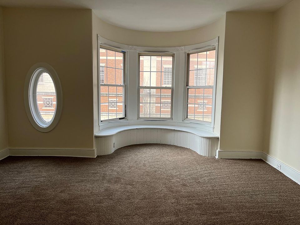 Huge bedroom with lots of windows