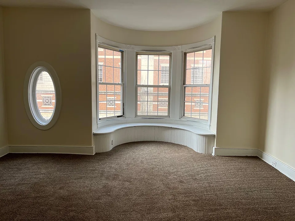 Huge bedroom with lots of windows