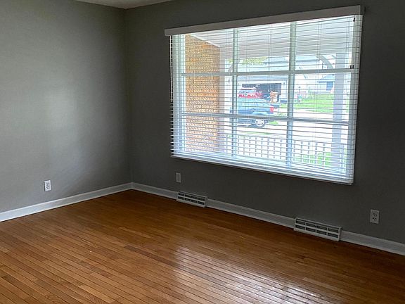 It's great having a living room and a family room. The living room has great lighting with well-maintained hardwood floors.