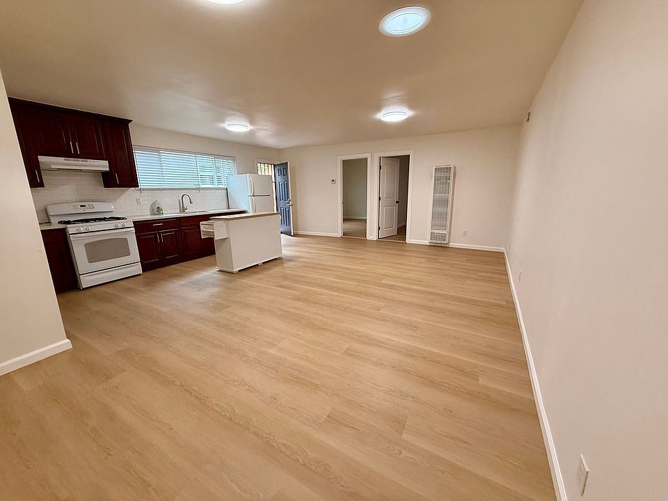 Great-room and kitchen with view towards front door and bedrooms