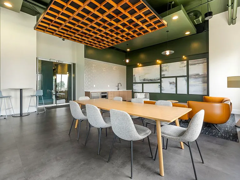Resident lounge with coworking spaces and kitchenette