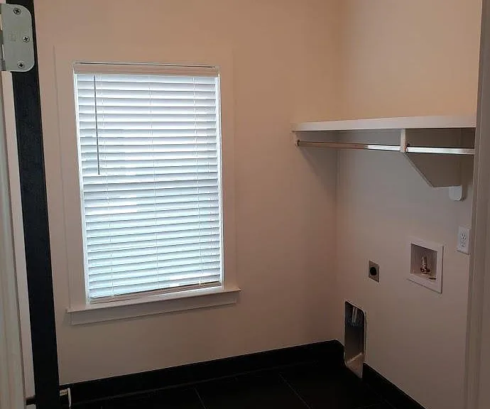 Upstairs laundry room.