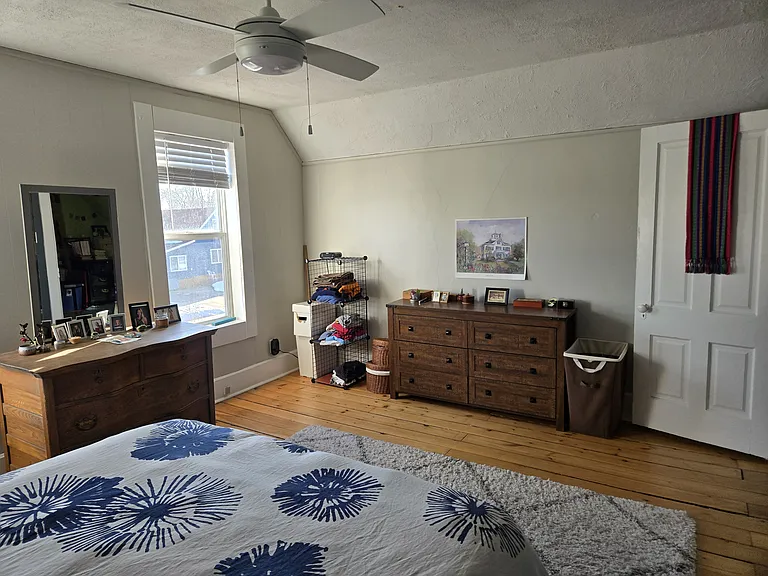 This bedroom has room for two large dressers