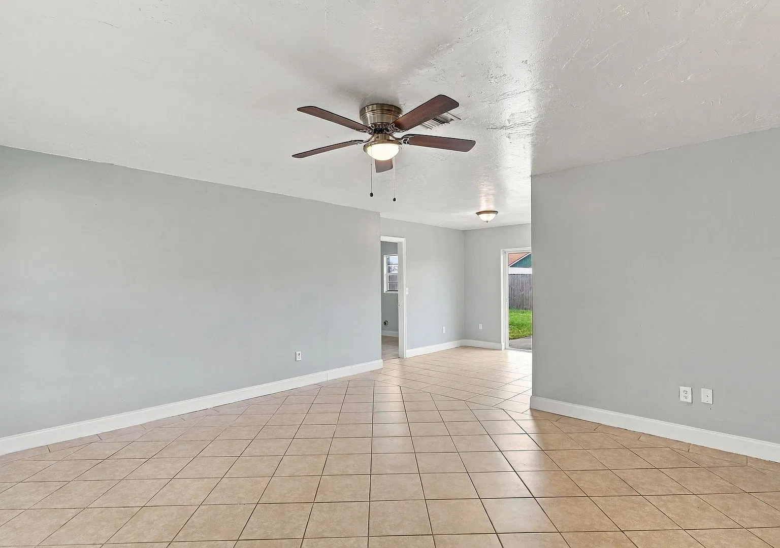 Freshly Painted 3-Bedroom, 2-Bathroom Home with Spacious Kitchen, Fenced Yard & Carport — Photo 4