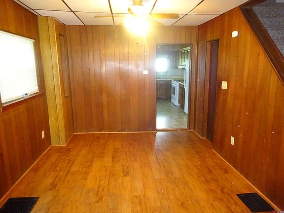 View of dining room and steps to upstairs