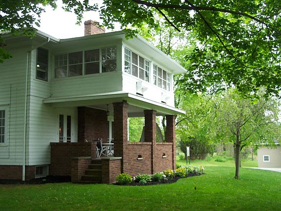 Covered 1st story porch w/hook up for hot tub & enclsosed 2nd story porch