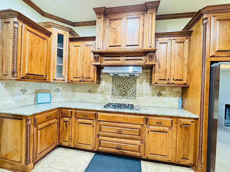 Kitchen- with granite countertops and cabinets