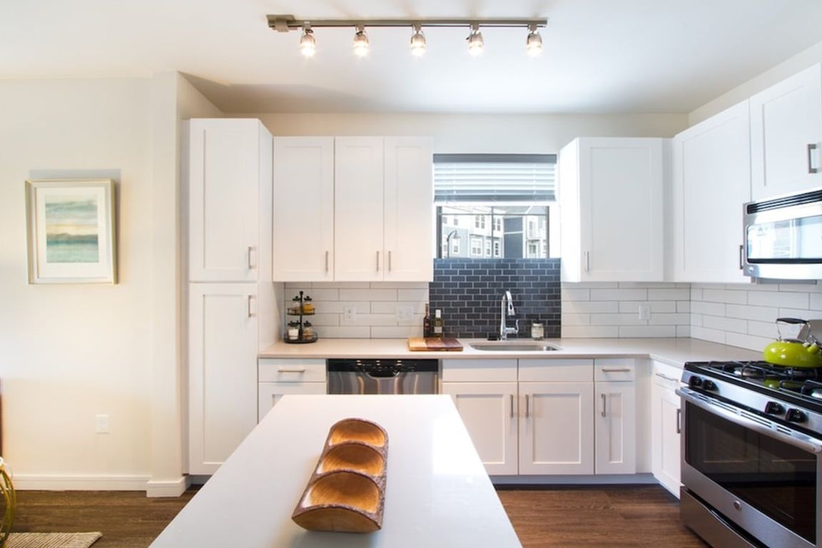 Quartz countertops, stainless steel appliances and custom cabinets in our contemporary kitchens