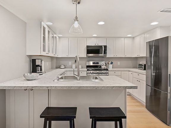 Kitchen with all stainless steel appliances, gas stove