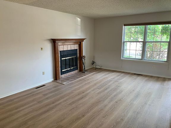 New floors in living room! Real fireplace.