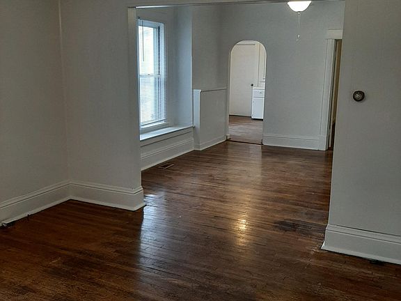 living room and dining room looking into kitchen