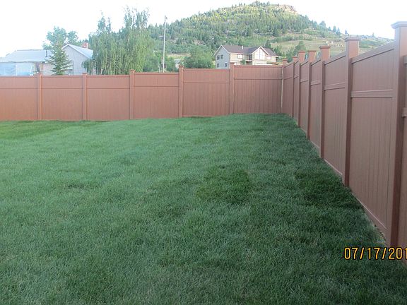 New sod & cedar vinyl fence