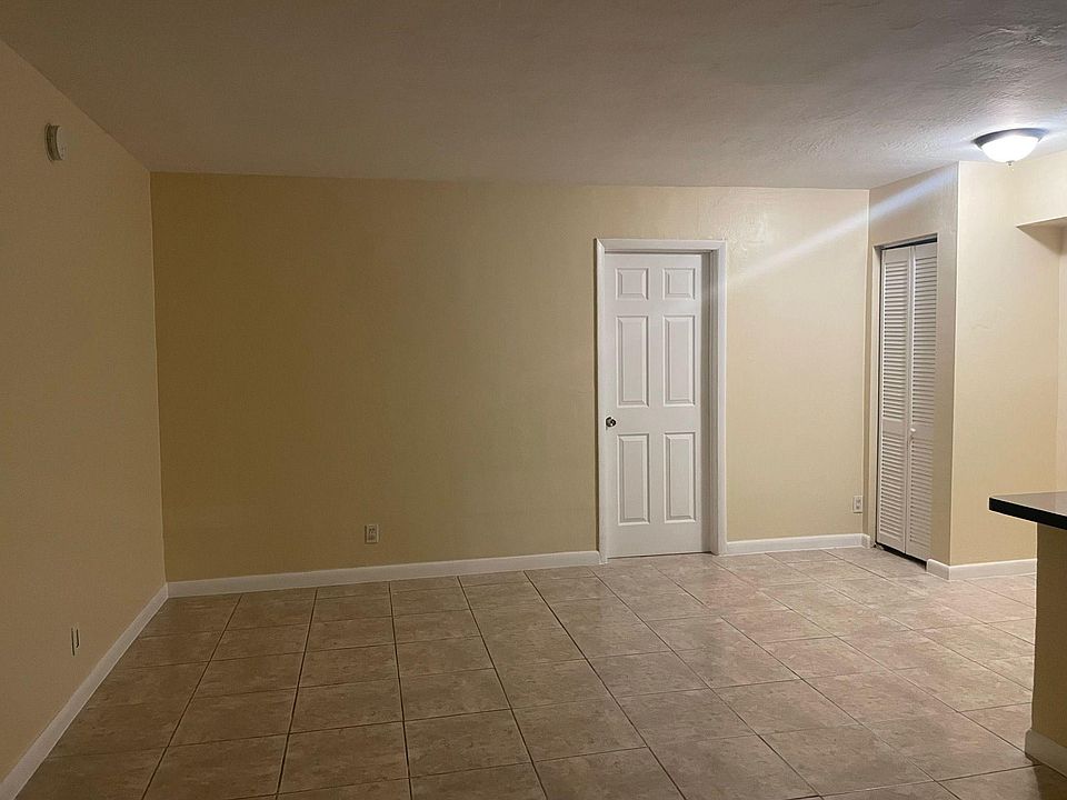 Large living and dining room area with storage