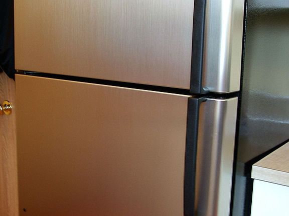 Stainless fridge with ice maker.