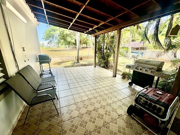 The house is equipped with a gas generator and transfer switch that connects to the electrical grid.