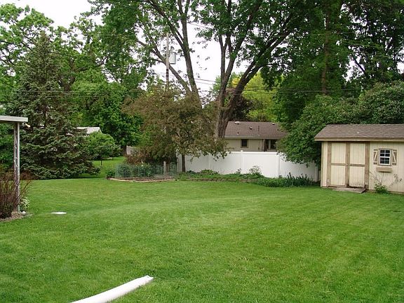 Large back yard with a newer garden shed