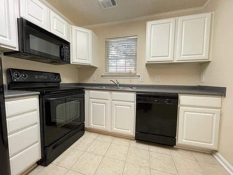 Functional kitchen with ample cabinet and pantry storage